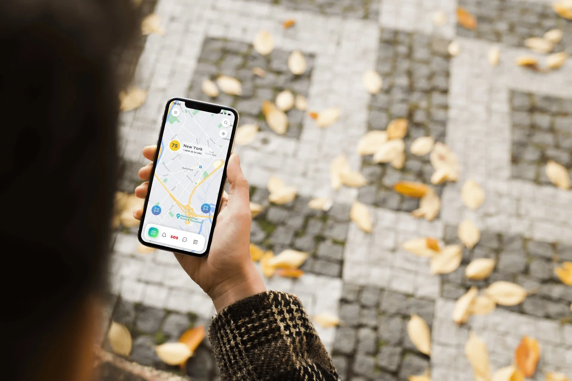 Alert Traveler mobile app mockup showing the redesigned home screen on an iPhone